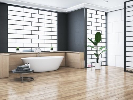 Clean bathroom interior with bathtub, abstract windows and reflections on wooden flooring. 3D Rendering