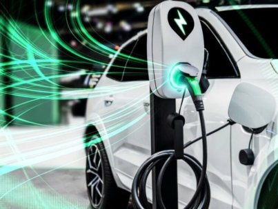 EV charging station for electric car in concept of green energy and eco power produced from sustainable source to supply to charger station in order to reduce CO2 emission .